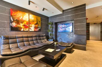 a living room with a couch and a table at Hotel Zeta in Budva