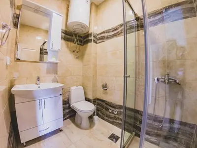 a bathroom with a toilet sink and a shower at Apartments Krstovic in Sutomore