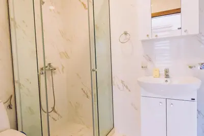 a bathroom with a shower and a sink at Apartments Krstovic in Sutomore