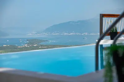 a swimming pool with a view of the water at Villa Gorazda in Kotor