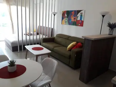 a living room with a couch and a table at Apartman Nina in Bar