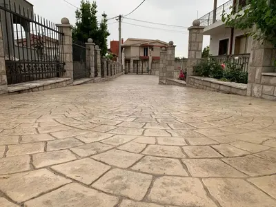 a cobblestone street in front of a house at Andolly Apartments in Bar