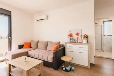 a living room with a couch and a table at Apartment L'ideal in Ulcinj