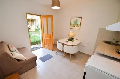 a living room with a couch and a table at Tea apartments in Kotor