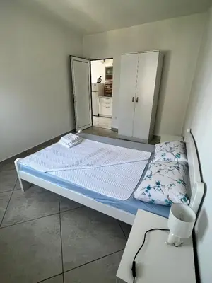 a hospital bed in a room with a mirror at Apartments Apartmani Bojana in Utjeha