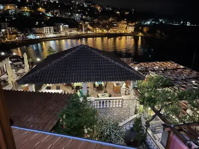 a view of a river at night with a building at Apartments Kalaja in Ulcinj