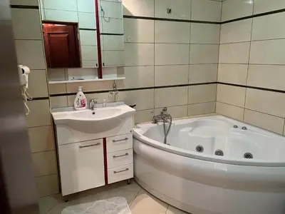 a bathroom with a white tub and a sink at Apartments Kalaja in Ulcinj