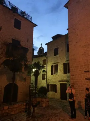 a man taking a picture of two buildings at Chic & Stylish with Seaview-Terrace - Kotor Indah in Kotor
