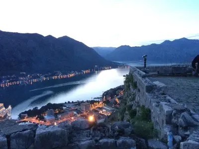 a view of a river at night with mountains at Chic & Stylish with Seaview-Terrace - Kotor Indah in Kotor