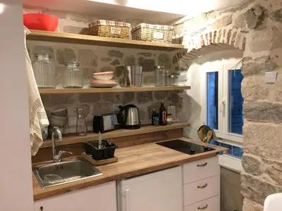 a kitchen with a sink and a counter top at Chic & Stylish with Seaview-Terrace - Kotor Indah in Kotor