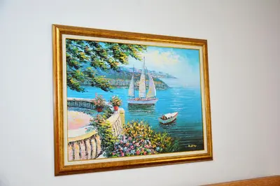 a painting of a painting of a sailboat on the water at Apartments Olive in Kotor