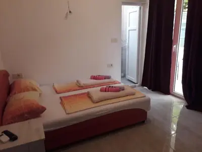 a bedroom with two beds in a room at Apartmani Andrea-jaz in Budva