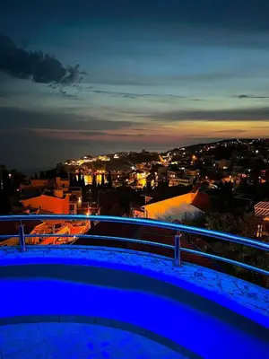 a view of a city at night from a balcony at Apartments Amina in Ulcinj
