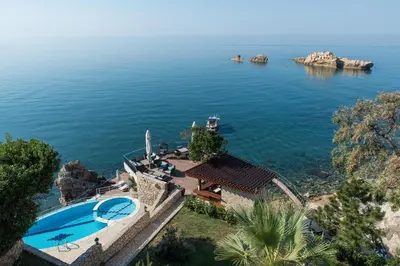 an aerial view of a swimming pool next to the water at Apartments Eneida in Ulcinj