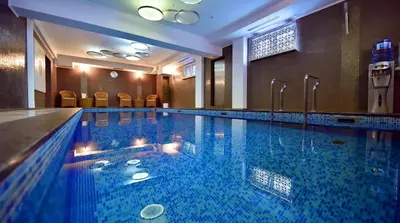 a large swimming pool in a hotel room at Hotel Ziya in Podgorica