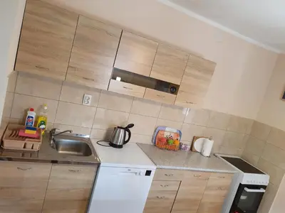 a kitchen with a sink and a counter top at Apartment Marta in Kotor