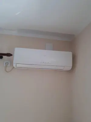 a white air conditioner on a wall in a room at Apartment Marta in Kotor