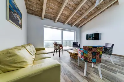 a living room with a couch and chairs at Villas Adriatic Horizonte in Budva