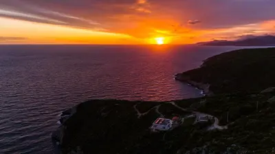 an aerial view of a sunset over the ocean at Villa Nerin in Zagora