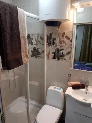 a bathroom with a shower and a toilet and a sink at Apartments Vila Galileo in Budva