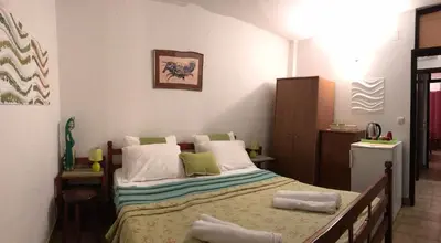 a bedroom with a bed with towels on it at Miron apart&rooms in Rafailovici