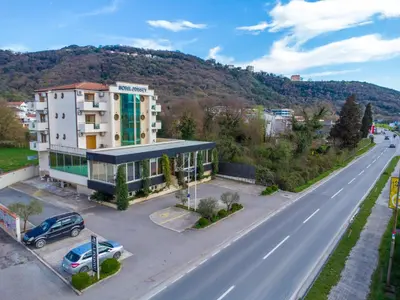 an aerial view of a building next to a road at Hotel Odissey Jaz in Budva