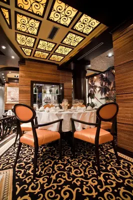 a dining room with a table and two chairs at Hotel Odissey Jaz in Budva