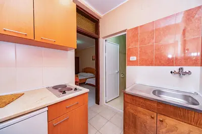a kitchen with a sink and a counter top at Villa Glavanovic in Bar