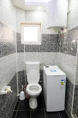 a small bathroom with a toilet and a window at Apartmani Marojević, Bar in Bar