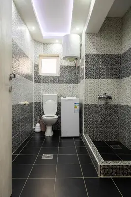 a bathroom with a toilet and a shower at Apartmani Marojević, Bar in Bar