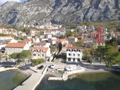 an aerial view of a small town in front of a mountain at Apartment Iv in Kotor