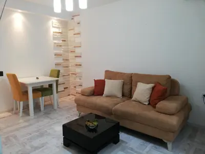 a living room with a couch and a table at Apartment Iv in Kotor