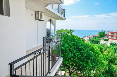 an apartment balcony with a view of the ocean at Apartments Cejovic in Ulcinj
