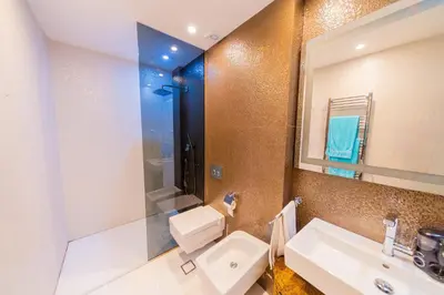 a bathroom with a sink and a mirror at Villas Vita & Dola in Budva