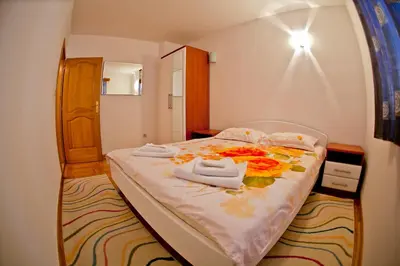 a bedroom with a bed with towels on it at Apartments Stefan in Becici