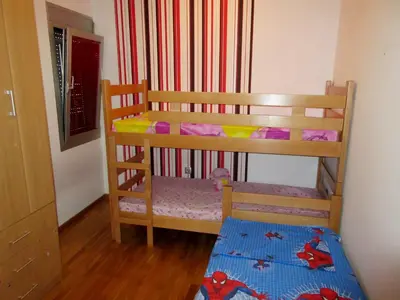 a childs bunk bed in a room at Dvosoban stan, Babin Do, Budva sa garazom in Budva