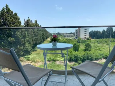 a table and chairs on a balcony with a view at Rasi Luxury Apartments in Ulcinj