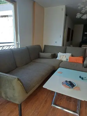 a living room with a couch and a coffee table at Lux Apartment Luna in Sveti Stefan