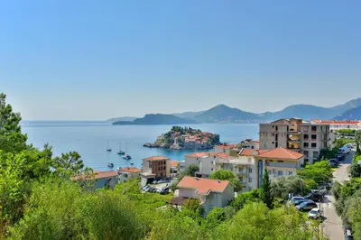 a view of a city and the water at Lux Apartment Luna in Sveti Stefan