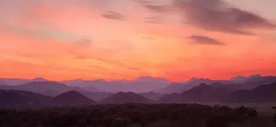 a view of a mountain range at sunset at Lotus House Dodoši in Dodoši