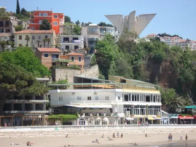 a view of the beach and buildings at Apartments Djakonovic in Ulcinj