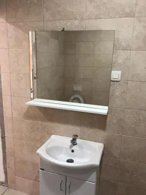 a bathroom with a sink and a mirror at Apartmani Maja in Bar
