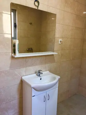 a bathroom with a sink and a mirror at Apartmani Maja in Bar