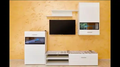 a white desk with a tv on a wall at Central Magik Apartments in Kotor