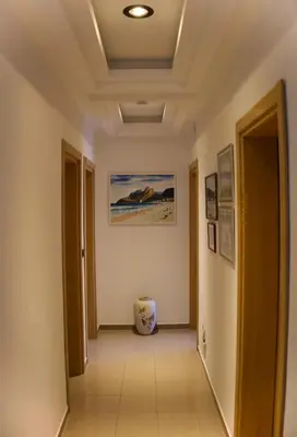 a corridor of a room with a ceiling at Apartments Grabovica in Bar