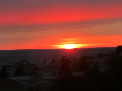 a sunset with the sun setting in the sky at Apartments Grabovica in Bar