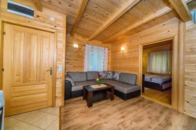 a living room with a couch and a table at Apartments Aura in Utjeha