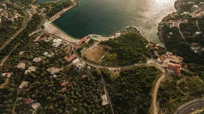 an aerial view of a park next to the water at Apartments Aura in Utjeha