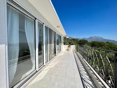a balcony of a building with a view of the mountains at Green Villa in Olives in Bar