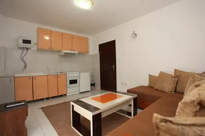 a living room with a couch and a table at Apartments Memidz in Budva